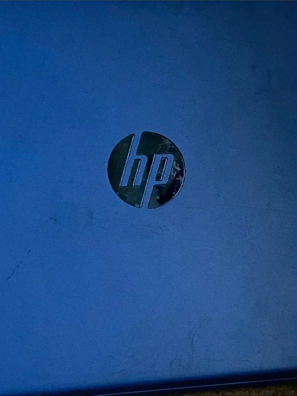 HP Blue Laptop with Silver Logo